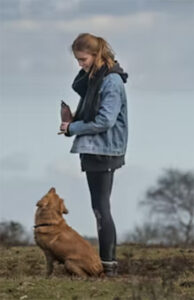 woman standing with dog