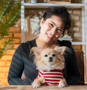 woman holding a dog